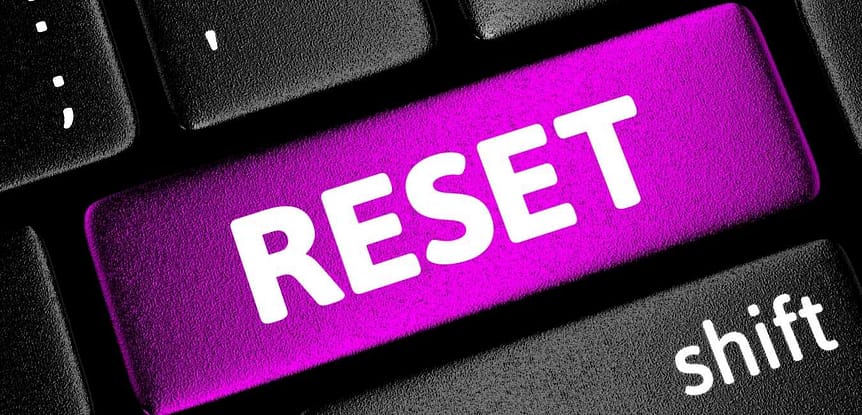 How to hit the RE-START Button for Your Fitness. Magenta reset button on a computer keyboard.